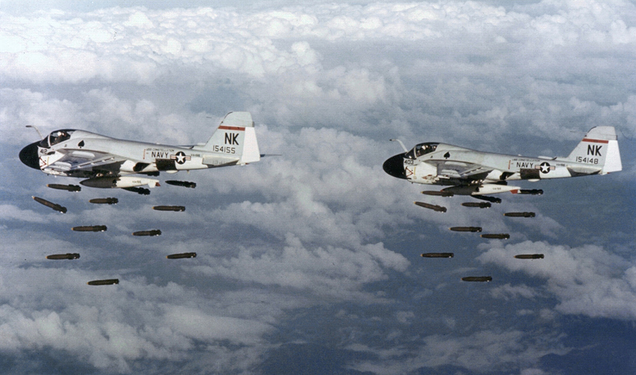 US Navy Grumman A-6A Intruders from Attack Squadron 196 (VA-196) “Main Battery” flying from the carrier USS Constitution (CVW 14) drop Mk 82 500-pound bombs over Vietnam in 1968. (US Navy)